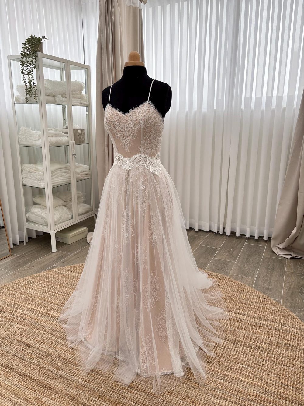 Wedding dress with a sweetheart lace bodice and a soft tulle skirt that falls in light layers.
