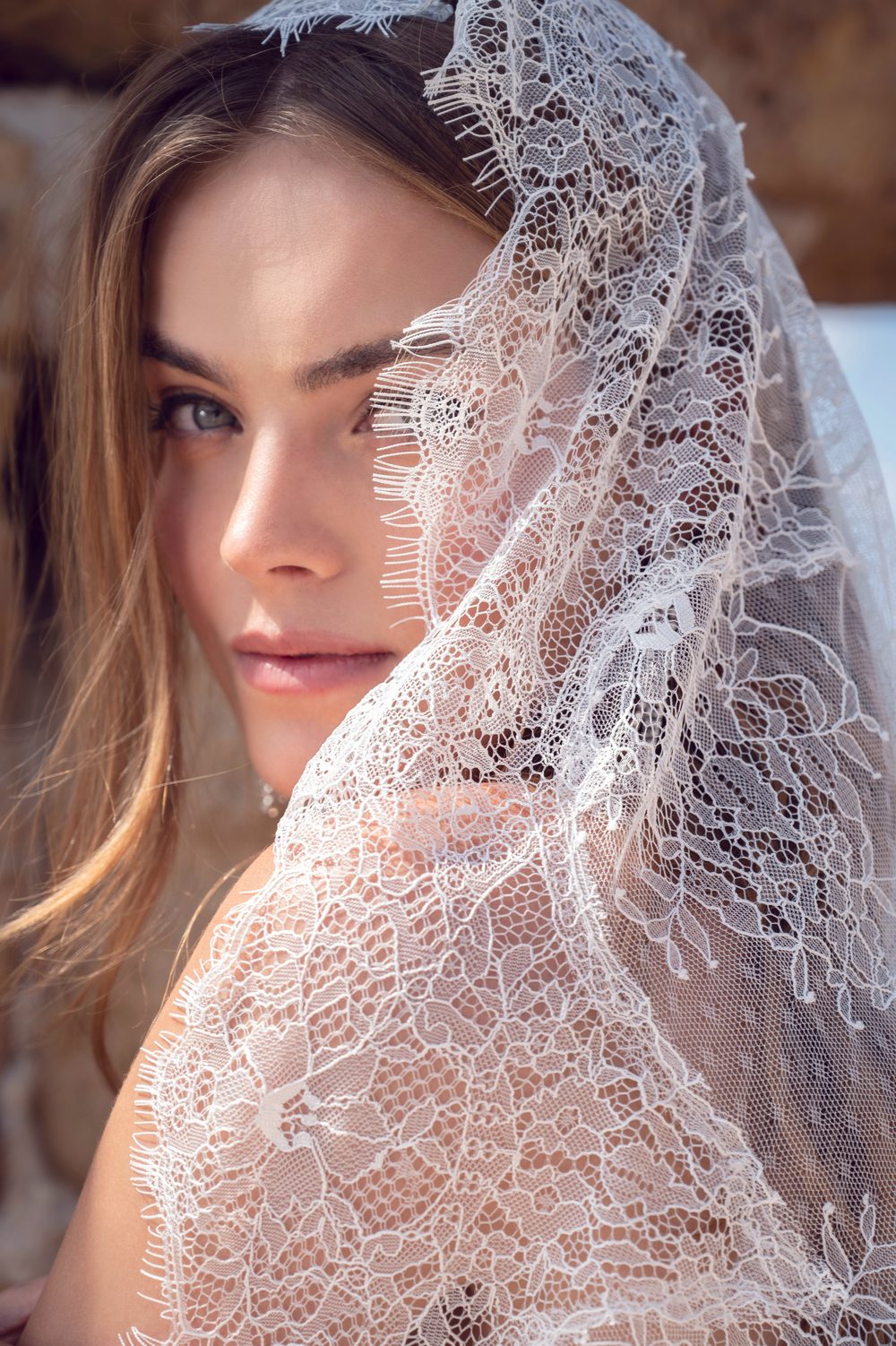 Wedding veil in soft tulle with a floral French lace edge.